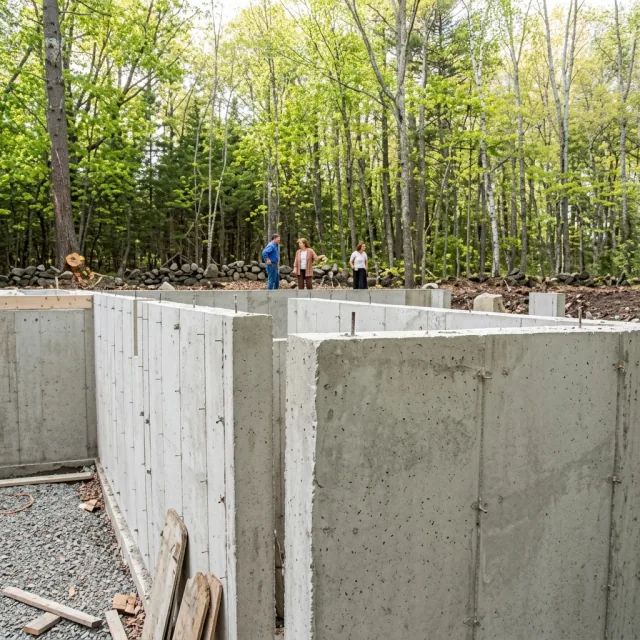 Poured concrete basement walls on a forested site
